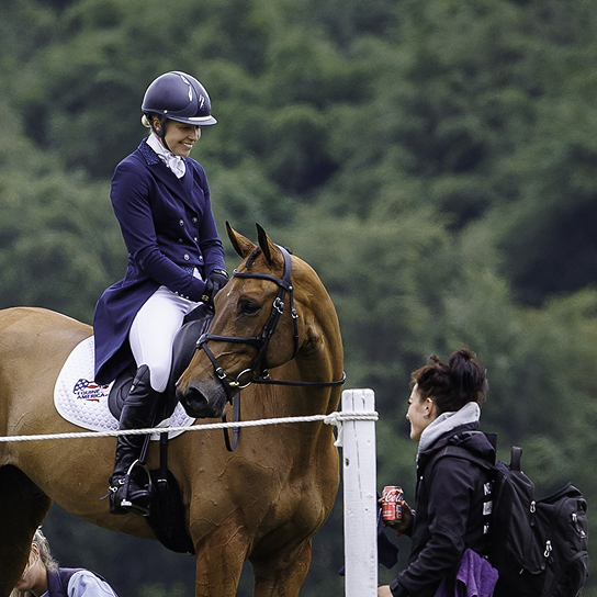 Georgie Campbell smiling on horse